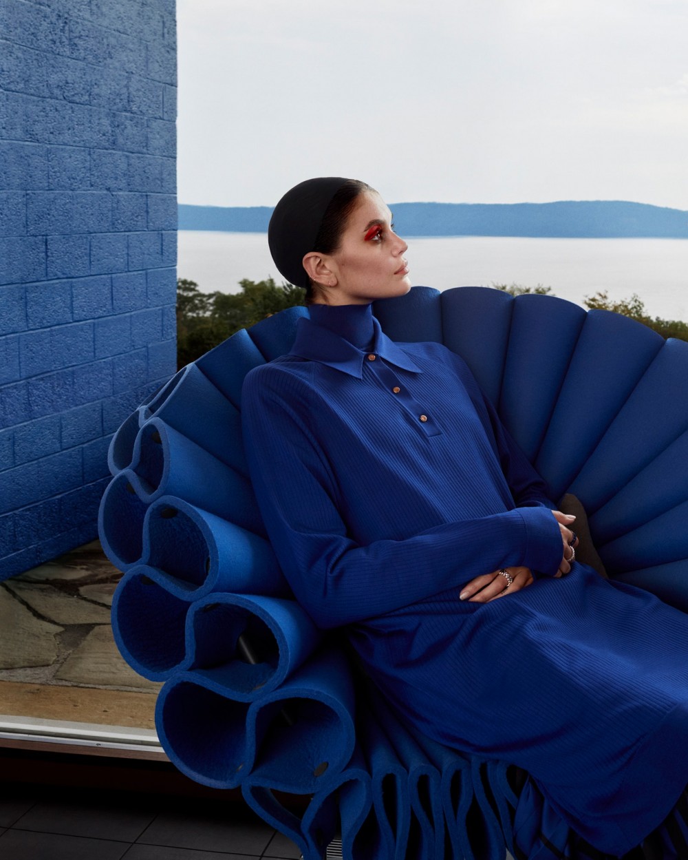 pGerberin an armchair by artist and designer Dror Benshetritholds to the straight and narrow in an Herms cobaltblue polo...