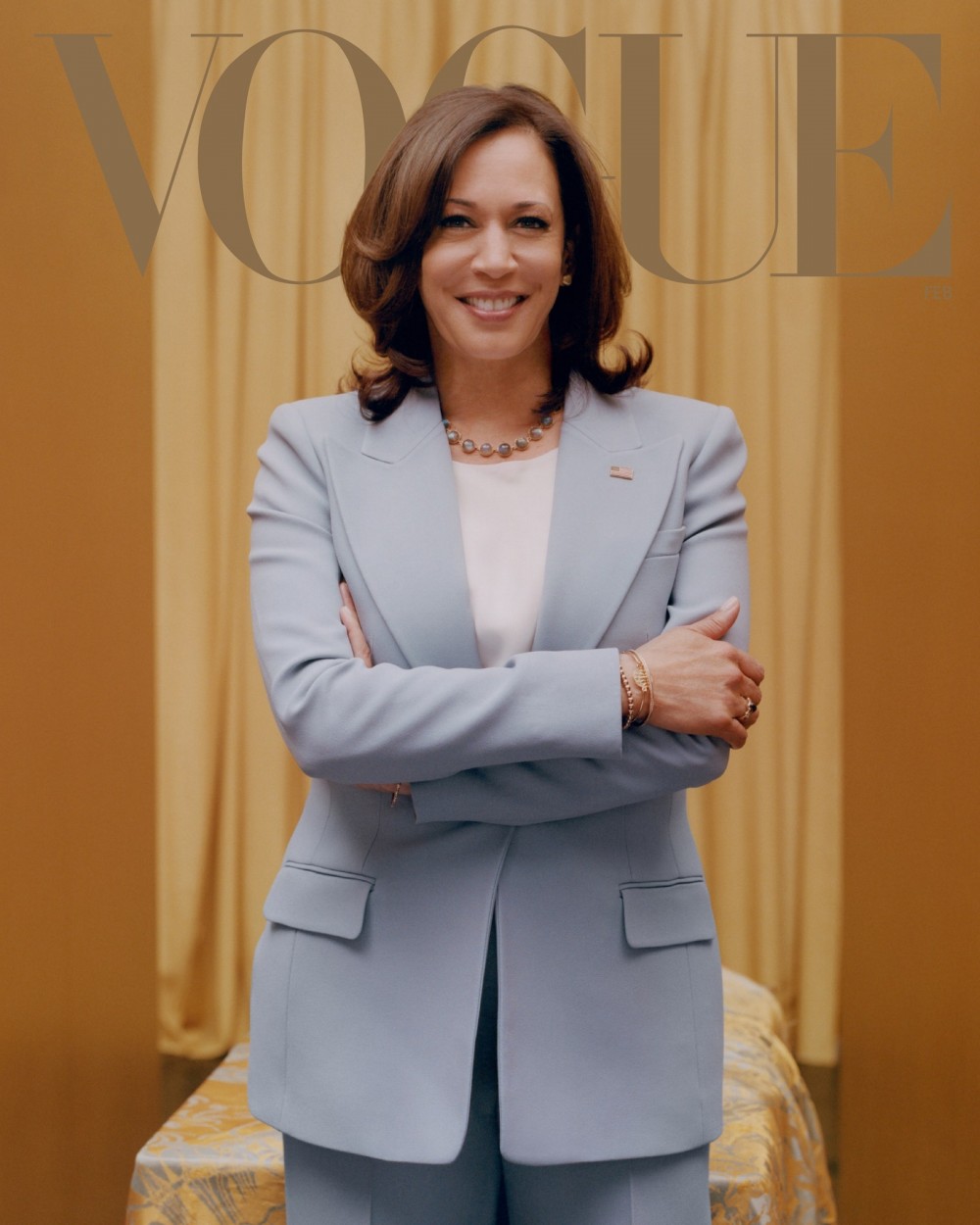 Image may contain Kamala Harris Clothing Apparel Suit Coat Overcoat Human Female Person Woman Jacket and Blazer