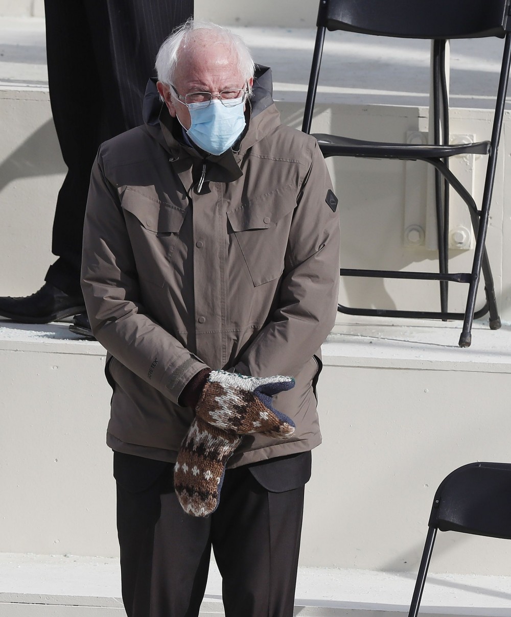 Senator Bernie Sanders of Vermont wearing a Burton coat and knit gloves by Jen Ellis at the inaugural ceremony. January...