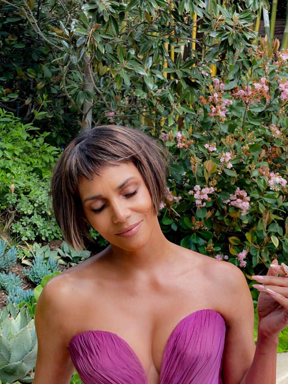 Image may contain Halle Berry Clothing Apparel Human Person Evening Dress Fashion Gown Robe Plant and Flower