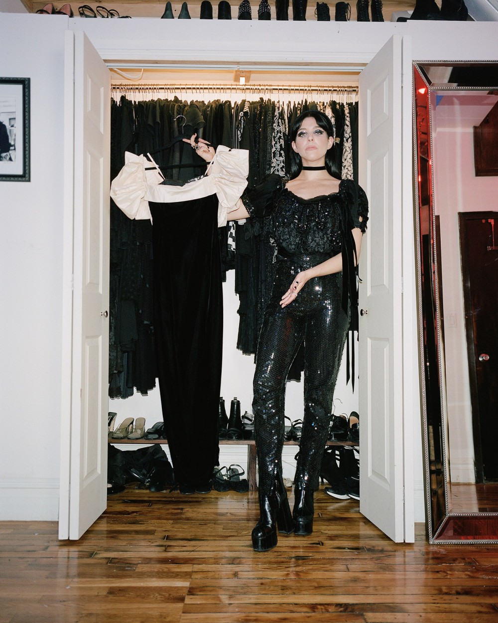 Blair wears a black Victorian top from Le Grand Strip black sequin 90s Gianna Versace Couture pants with silver Medusa...