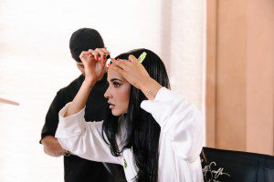 Becky applies Sleek & Shine Frizz Tamer.