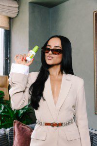 Becky G shows off her sleek, styled with Sleek & Stay serum.
