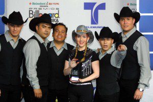 The band Grupo Limite hold their trophy after winning Album of the Year for a female group at the 12th Annual Billboard Latin Music Awards, April 26, 2001 in Miami Beach, Florida.